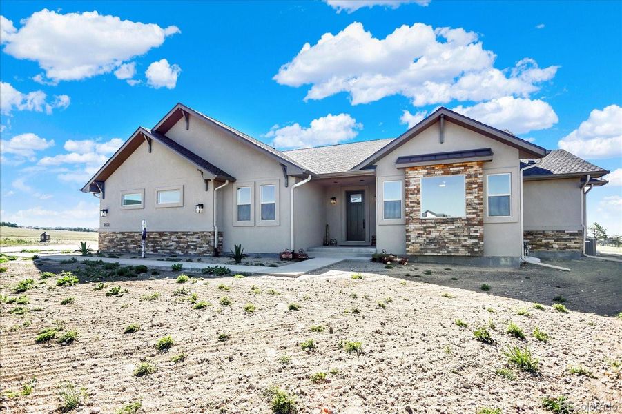 Front exterior of a new home in , Colorado Springs, CO, highlighting curb appeal (Image 23).
