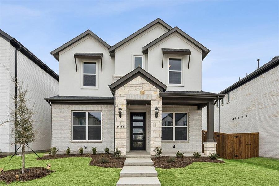 Front exterior of a new home in Lexington Frisco, Frisco, TX, highlighting curb appeal (Image 1). Front exterior of a new home in Lexington Frisco, Frisco, TX, highlighting curb appeal (Image 1).