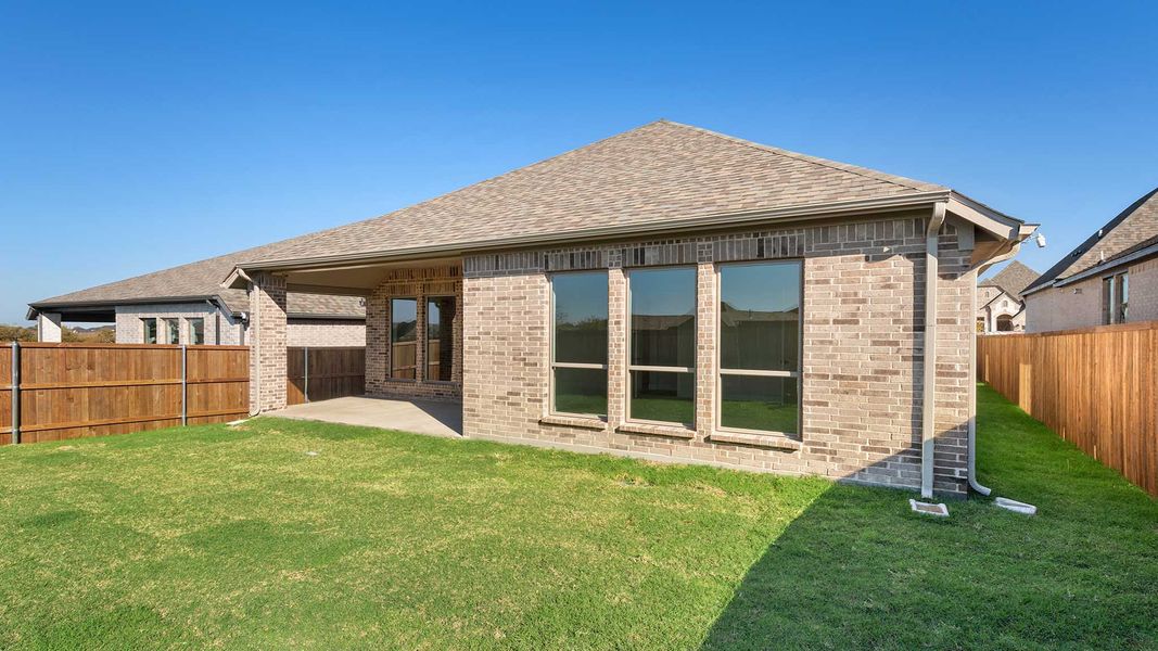 Exterior details and patio area of a home in Devonshire - Reserve 45', Forney (Image 3). Exterior details and patio area of a home in Devonshire - Reserve 45', Forney (Image 3).