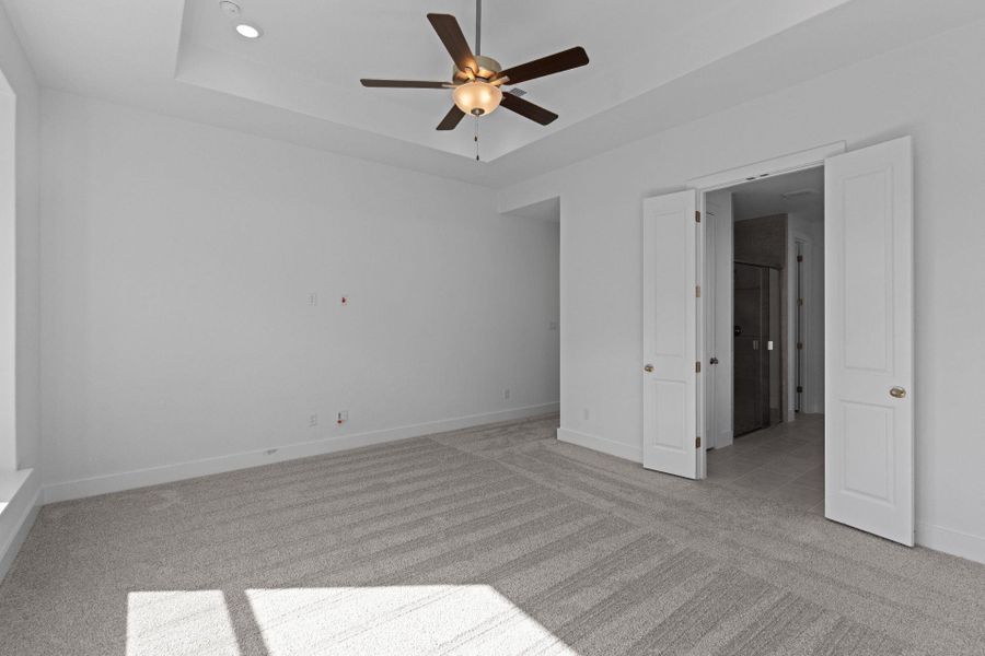 Primary Bedroom with elevated ceiling