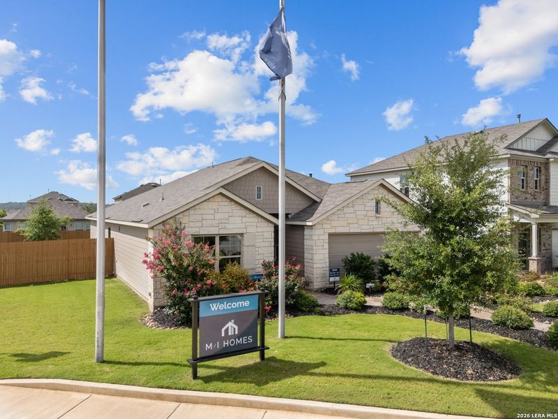 Front exterior of a new home in Winding Brook, San Antonio, TX, highlighting curb appeal (Image 15).