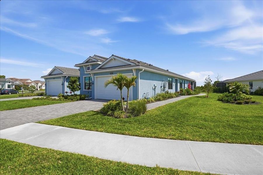 Front exterior of a new home in , Venice, FL, highlighting curb appeal (Image 23).