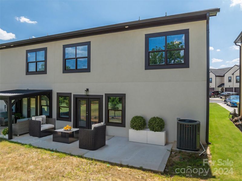 Back patio overlooking the 2nd fairway- virtually staged