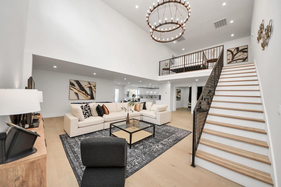 The gorgeous white oak flooring and elegant staircase add to the contemporary feel. The gorgeous white oak flooring and elegant staircase add to the contemporary feel.