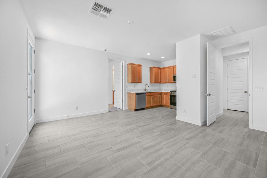 Representative unfurnished interior of a home built from the Caliber by Taylor Morrison in Artisan at Asante, Surprise (Image 21). Representative unfurnished interior of a home built from the Caliber by Taylor Morrison in Artisan at Asante, Surprise (Image 21).