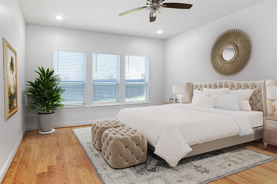 Bedroom with light hardwood / wood-style flooring and ceiling fan