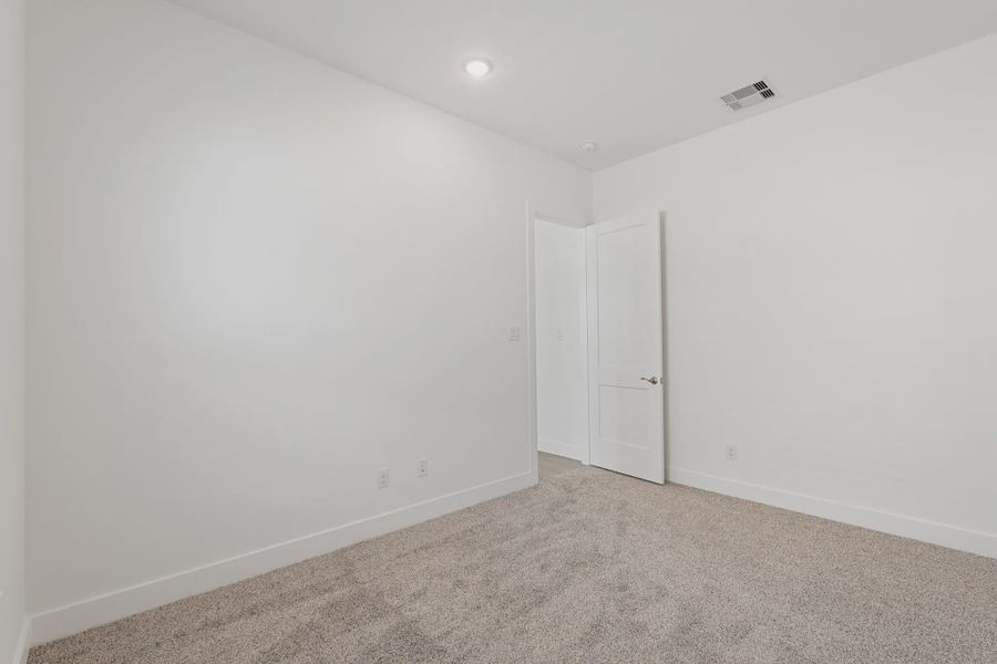 Representative unfurnished interior of a home built from the Brentwood by Chesmar Homes in Meridiana 50's and 60's, Manvel (Image 23).