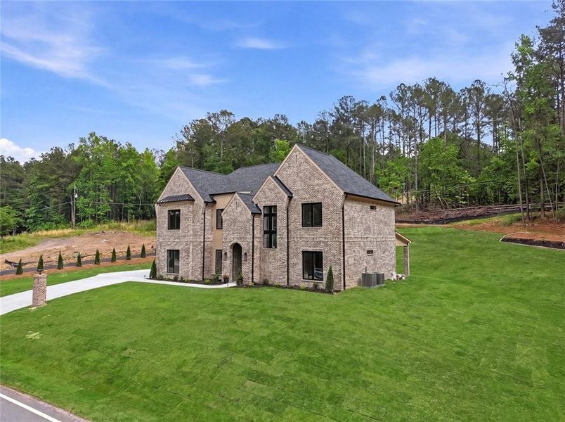 Front exterior of a new home in , Dacula, GA, highlighting curb appeal (Image 24).