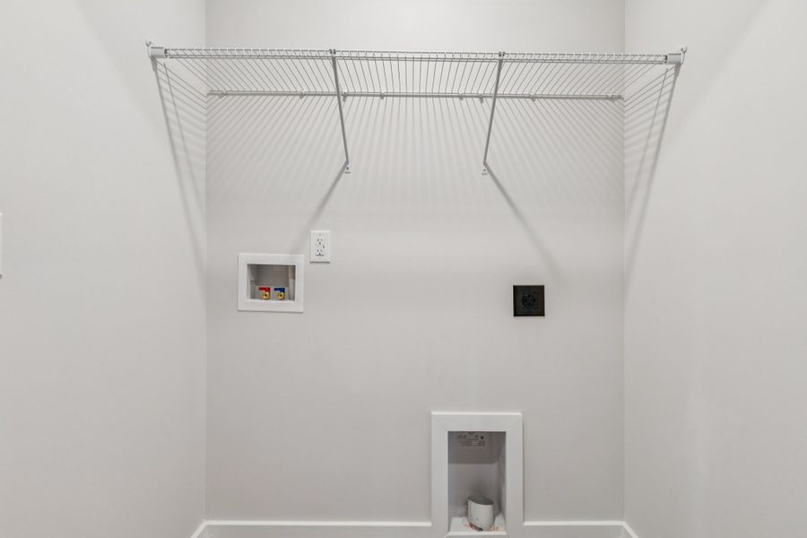 A white wall with a vent.