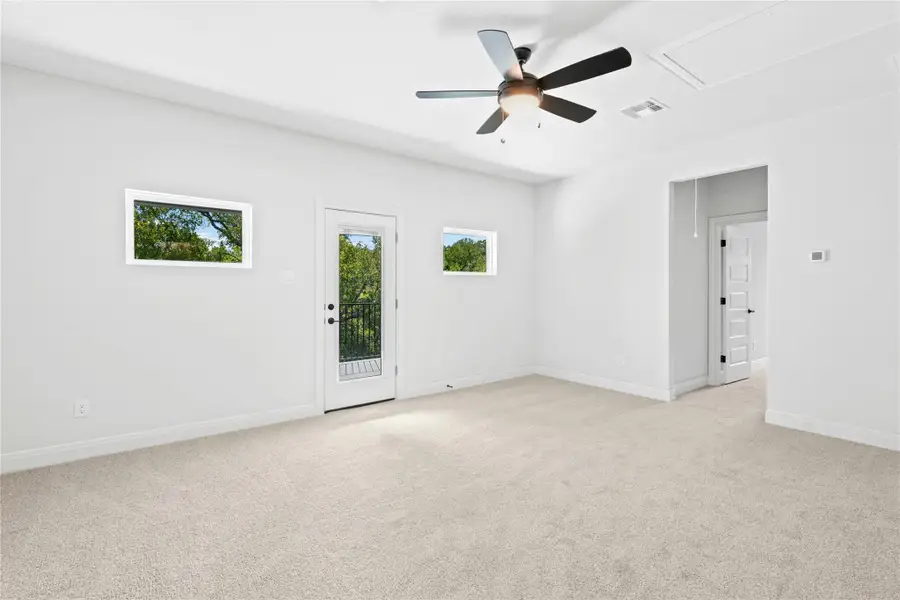 Upstairs game room with door to large 2nd floor covered patio. Upstairs game room with door to large 2nd floor covered patio.