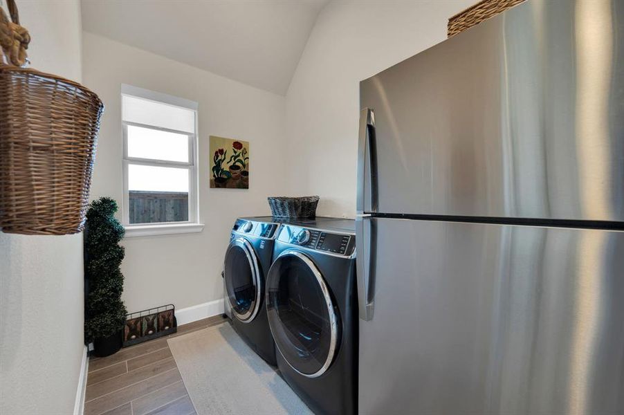 Large laundry area provides enough room for secondary refrigerator and located just off the morning room.