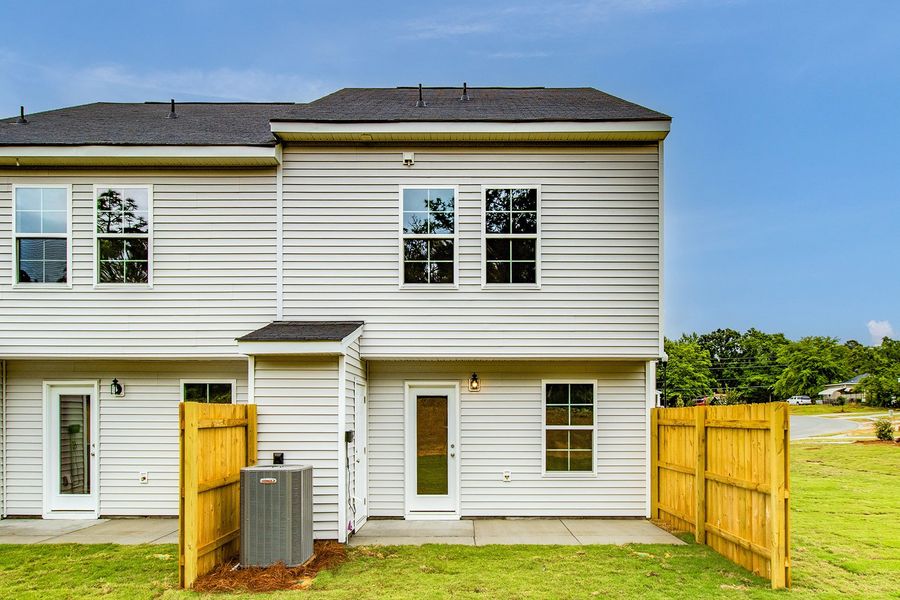 Exterior details and patio area of a home in Padgett Commons, Hopkins (Image 18).