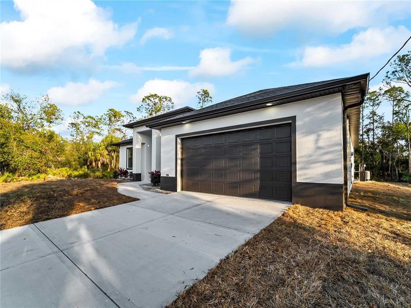 Front exterior of a new home in , Port Charlotte, FL, highlighting curb appeal (Image 28).