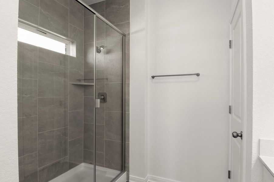 Bathroom featuring a shower stall