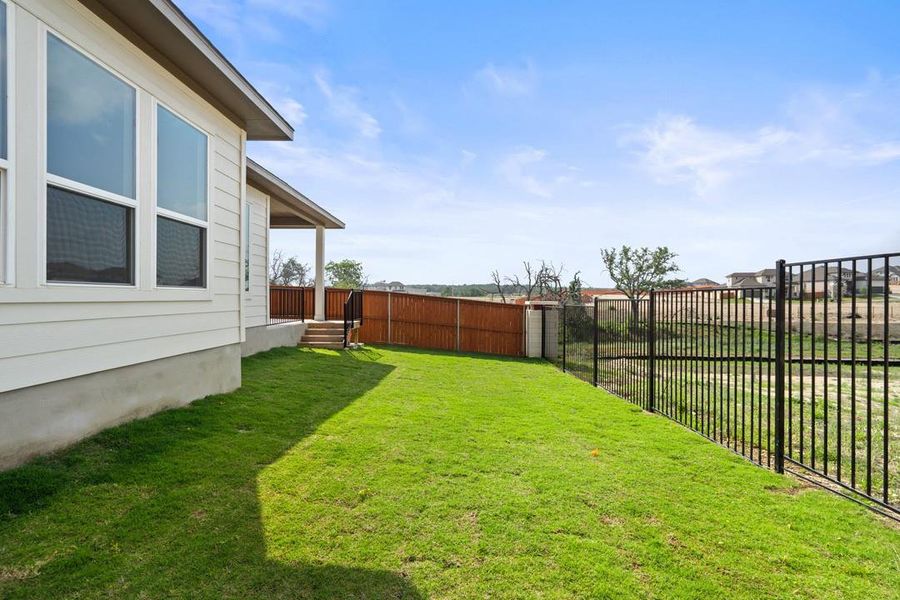 Front exterior of a new home in Park Collection at Lariat, Liberty Hill, TX, highlighting curb appeal (Image 24). Front exterior of a new home in Park Collection at Lariat, Liberty Hill, TX, highlighting curb appeal (Image 24).