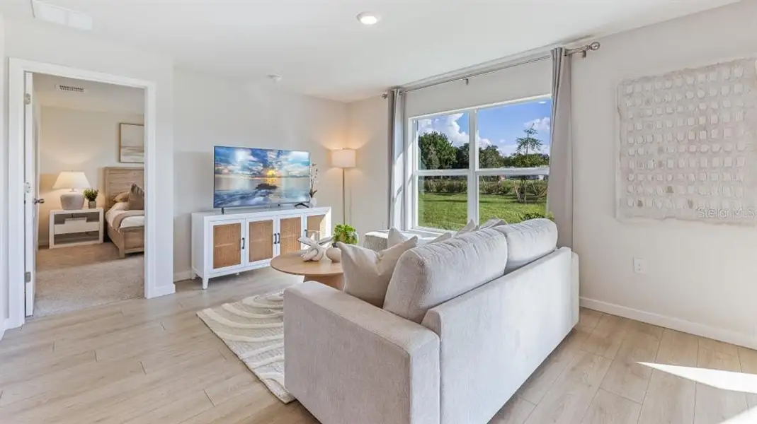 Furnished interior view inside a new home in Driftwood Bay, Port Charlotte (Image 3).