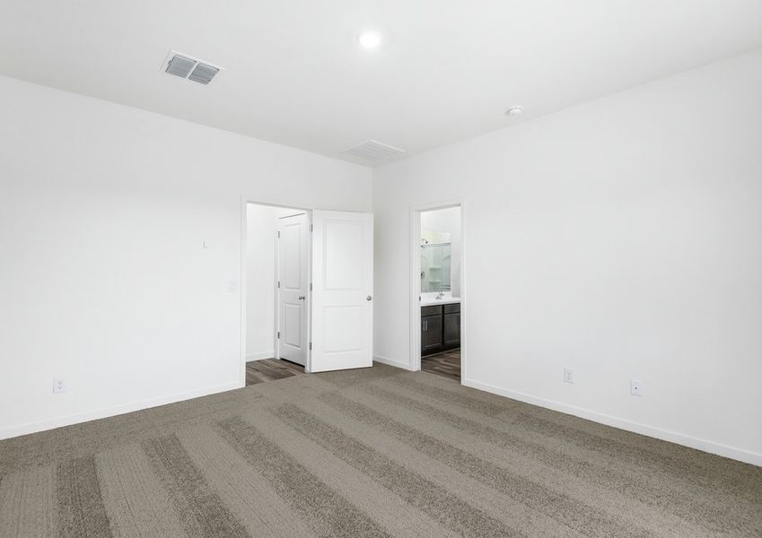 The master bedroom seamlessly connects to the upgraded bathroom. The master bedroom seamlessly connects to the upgraded bathroom.