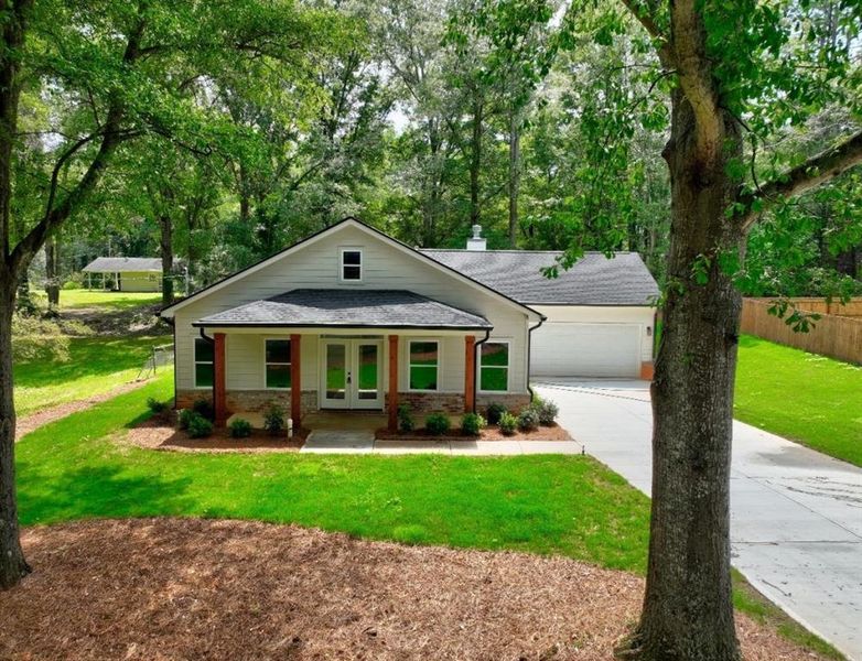 Front exterior of a new home in , Monroe, GA, highlighting curb appeal (Image 17).