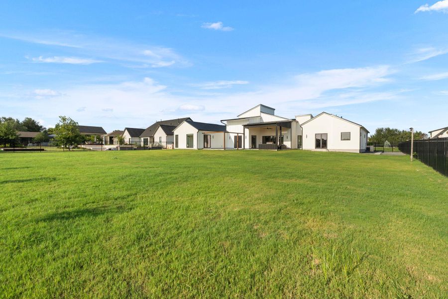 Front exterior of a new home in , Dripping Springs, TX, highlighting curb appeal (Image 27). Front exterior of a new home in , Dripping Springs, TX, highlighting curb appeal (Image 27).
