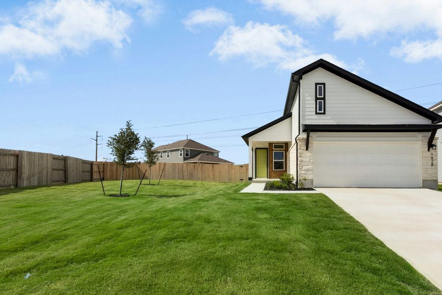 Front exterior of a new home in Willowbrook, New Braunfels, TX, highlighting curb appeal (Image 2). Front exterior of a new home in Willowbrook, New Braunfels, TX, highlighting curb appeal (Image 2).