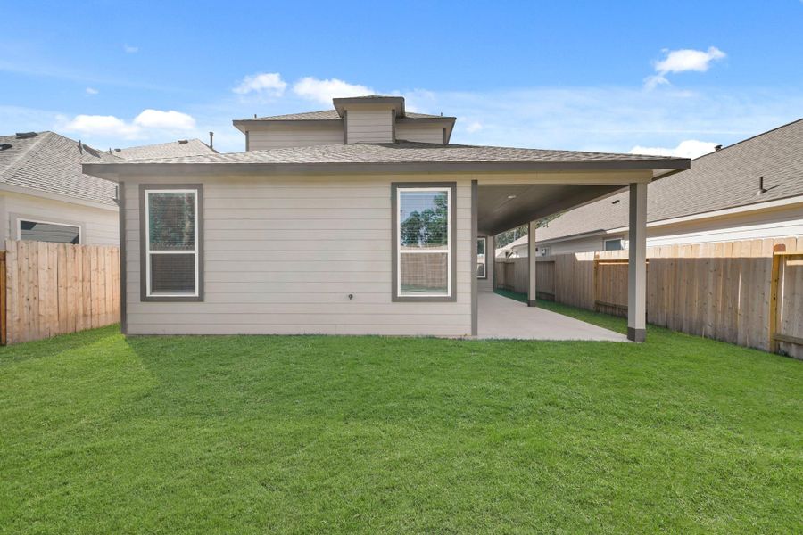 Exterior details and patio area of a home in Cypresswood Landing, Humble (Image 15).