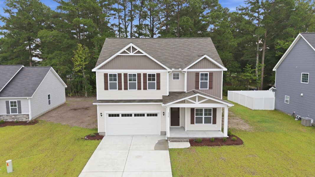 Front exterior of a new home in Davenport Farms, Winterville, NC, highlighting curb appeal (Image 20). Front exterior of a new home in Davenport Farms, Winterville, NC, highlighting curb appeal (Image 20).