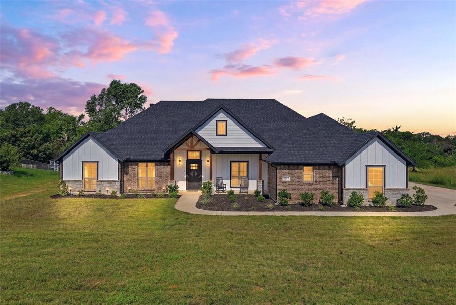 Front exterior of a new home in The Ranches at Valley View, Springtown, TX, highlighting curb appeal (Image 24).