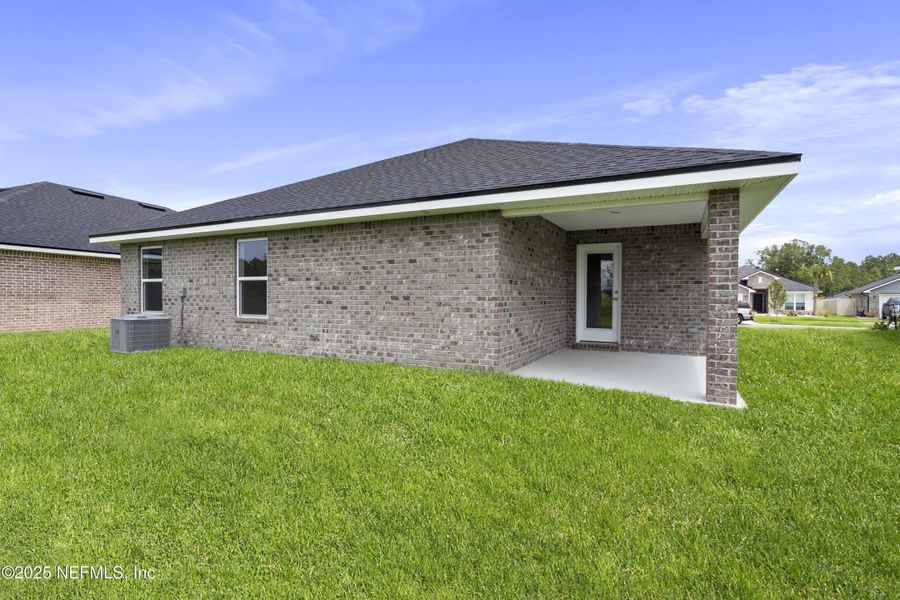 Exterior details and patio area of a home in Shadow Crest at Rolling Hills, Green Cove Springs (Image 3). Exterior details and patio area of a home in Shadow Crest at Rolling Hills, Green Cove Springs (Image 3).