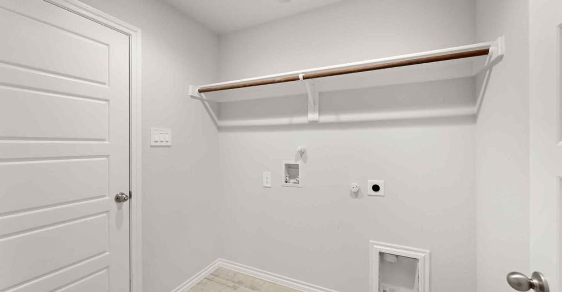 Representative exterior photo of a completed home built from the Atlanta by Impression Homes in Keeneland, Aubrey, TX (Image 23).