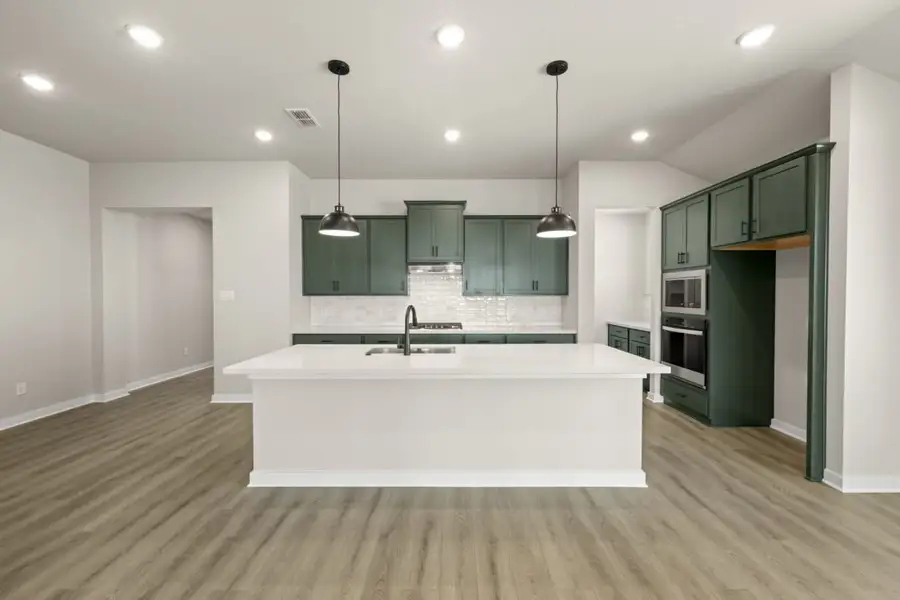 Representative furnished interior of a home built from the Sunterra Rowan 2104 by Brohn Homes in Sunterra, Katy (Image 4).