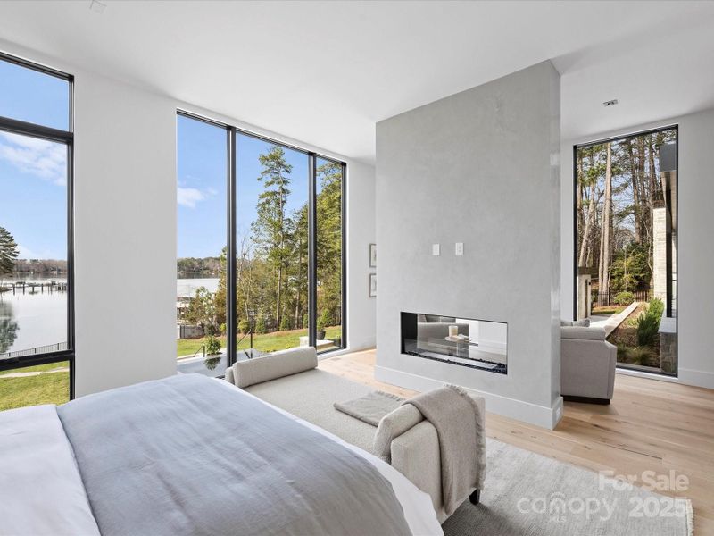 Primary bedroom featuring venetian plastered fireplace