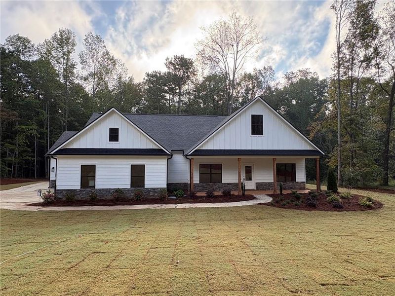 Front exterior of a new home in , Dallas, GA, highlighting curb appeal (Image 24).