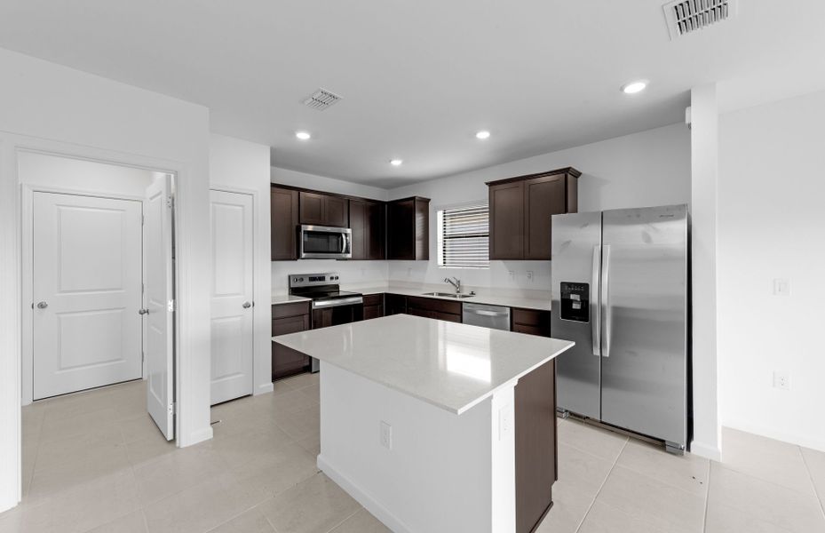 Furnished interior view inside a new home in Caloosa Cove, Labelle (Image 7).