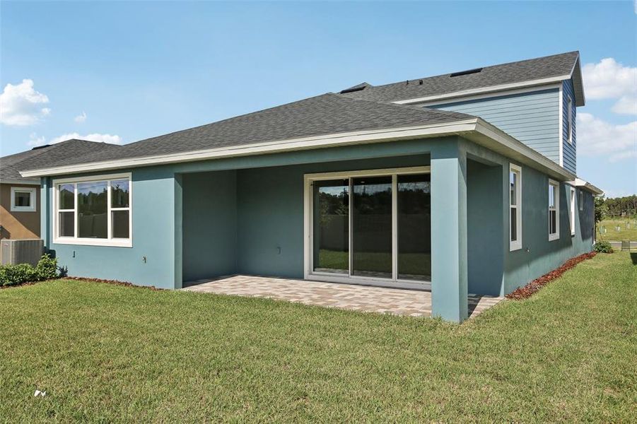 Front exterior of a new home in Primrose at Longleaf, New Port Richey, FL, highlighting curb appeal (Image 25).