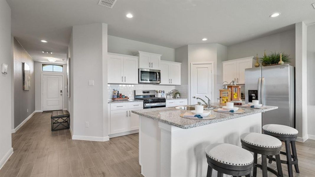 Kitchen - All Home and community information, including pricing, included features, terms, availability and amenities, are subject to change at any time without notice or obligation. All Drawings, pictures, photographs, video, square footages, floor plans, elevations, features, colors and sizes are approximate for illustration purposes only and will vary from the homes as built.