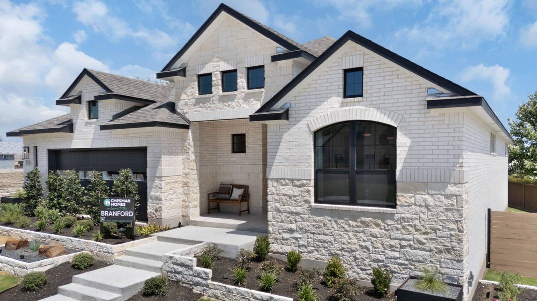 Front exterior of a new home in Highland Village, Georgetown, TX, highlighting curb appeal (Image 31). Front exterior of a new home in Highland Village, Georgetown, TX, highlighting curb appeal (Image 31).