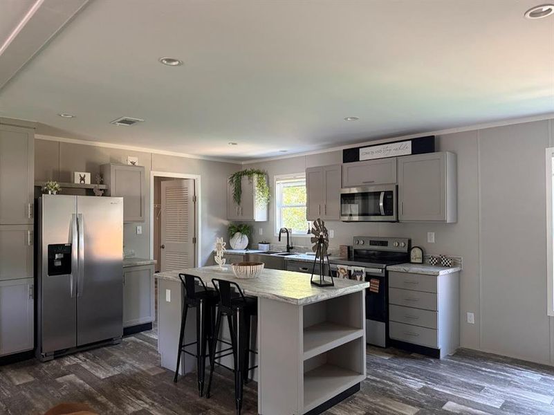 Furnished interior view inside a new home in , Pelican Bay (Image 4).