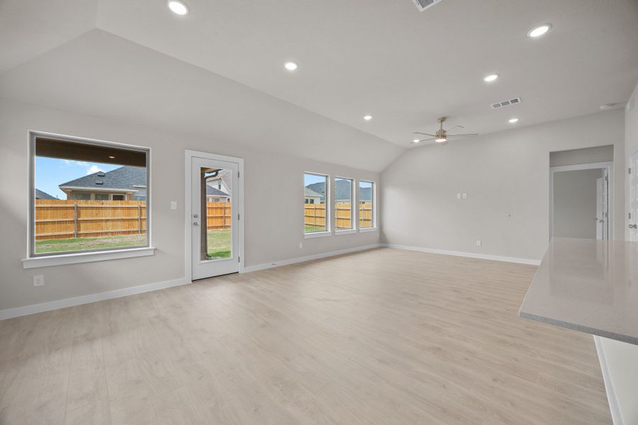 Dining and Living Area in the Brazos home plan by Trophy Signature Homes – REPRESENTATIVE PHOTO