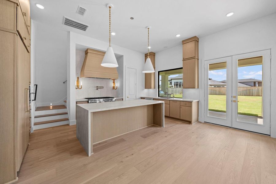 Beautiful kitchen and dining area with abundant natural light and views of the backyard.