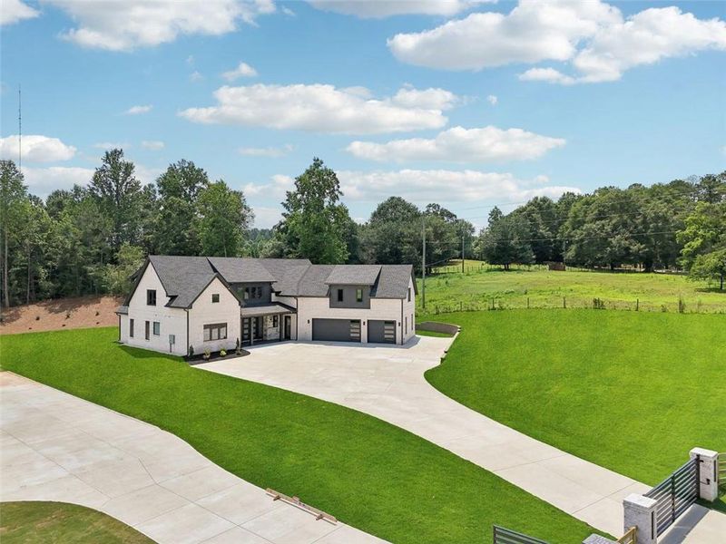 Front exterior of a new home in , Braselton, GA, highlighting curb appeal (Image 34). Front exterior of a new home in , Braselton, GA, highlighting curb appeal (Image 34).