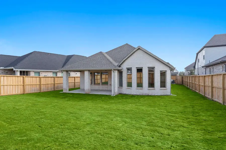 Exterior details and patio area of a home in Dunham Pointe 50', Cypress (Image 3).