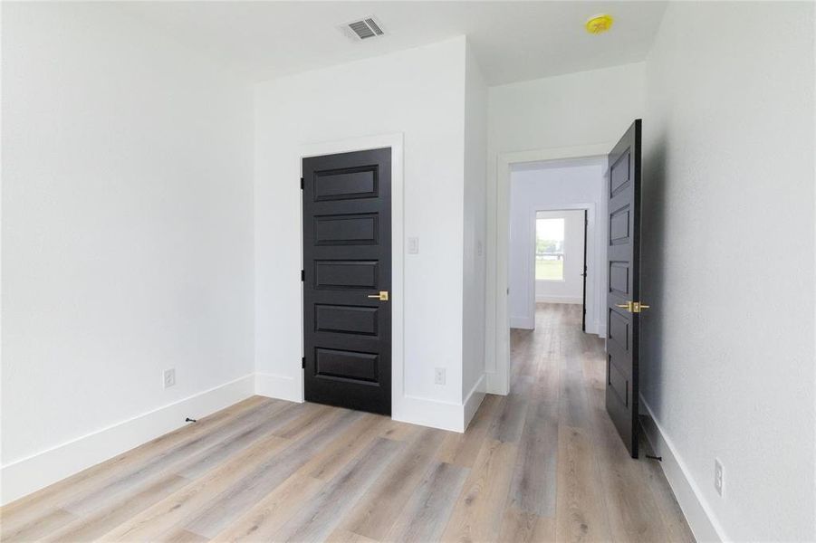 Unfurnished room featuring light wood-type flooring