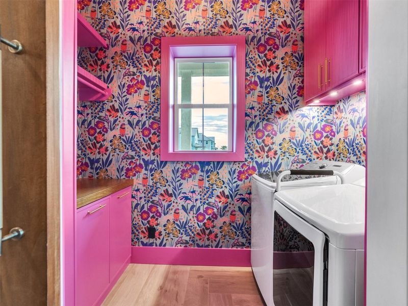 Laundry day feels surprisingly uplifting in this beautifully designed space. Behind the barn door awaits a bright and cheerful laundry room adorned with custom wallpaper that adds a playful, elegant touch. Thoughtful storage keeps everything organized, with plenty of room for folding, hanging clothes, and keeping essentials tucked away. It’s a functional yet stylish haven that turns a daily chore into a moment of calm — the perfect blend of beauty and purpose in this beachside home. Laundry day feels surprisingly uplifting in this beautifully designed space. Behind the barn door awaits a bright and cheerful laundry room adorned with custom wallpaper that adds a playful, elegant touch. Thoughtful storage keeps everything organized, with plenty of room for folding, hanging clothes, and keeping essentials tucked away. It’s a functional yet stylish haven that turns a daily chore into a moment of calm — the perfect blend of beauty and purpose in this beachside home.