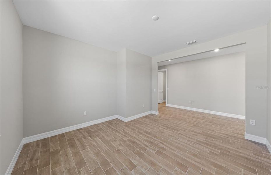 Spacious, unfurnished interior of a new home in The Strand at Cedar Grove, North Port (Image 21).