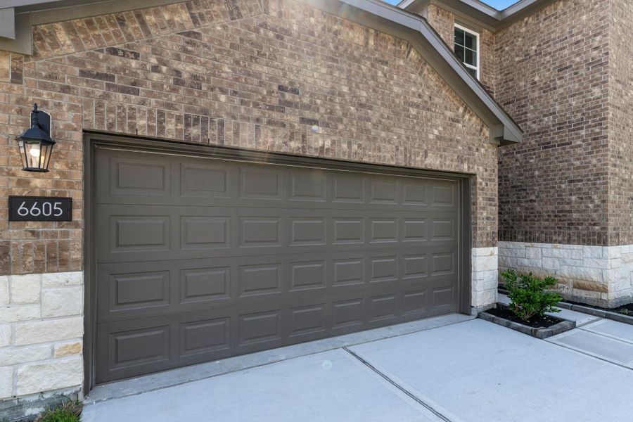 Front exterior of a new home in Springwood, Beaumont, TX, highlighting curb appeal (Image 24).