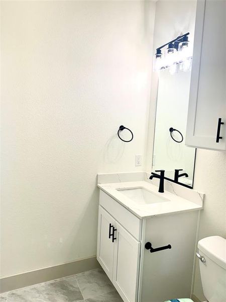 Bathroom with vanity and toilet