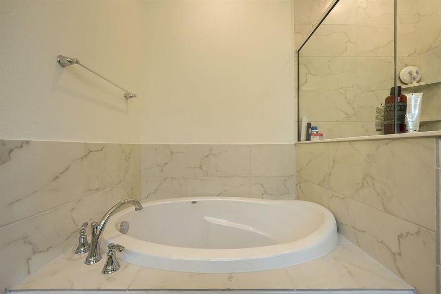 Bathroom featuring a washtub