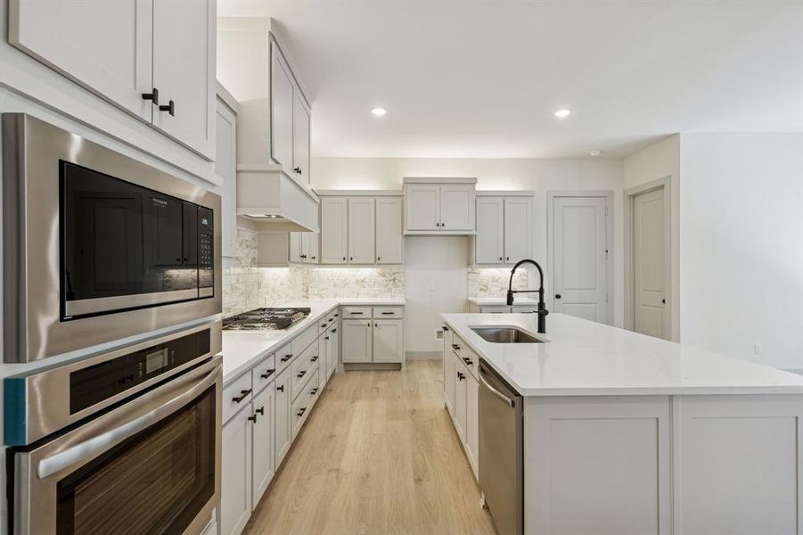 Fantastic storage paired with beautiful finishes combine to create the kitchen of your dreams in our Bella plan!