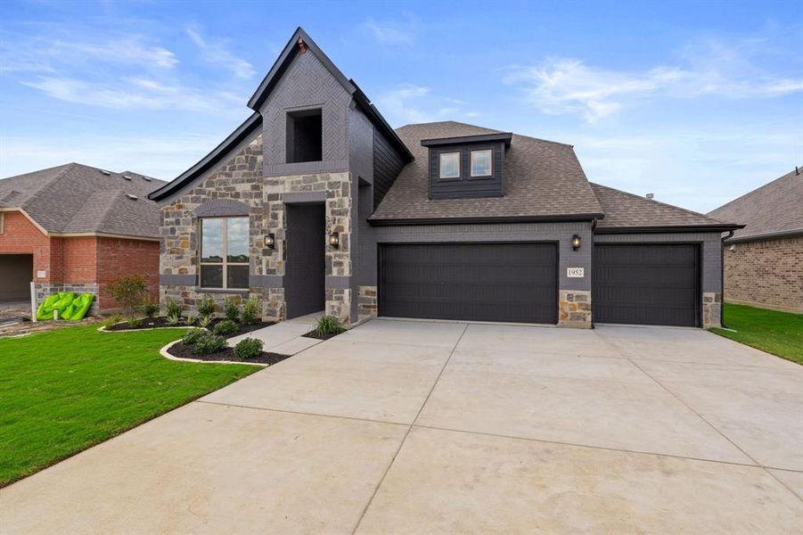 Front exterior of a new home in , Venus, TX, highlighting curb appeal (Image 21).