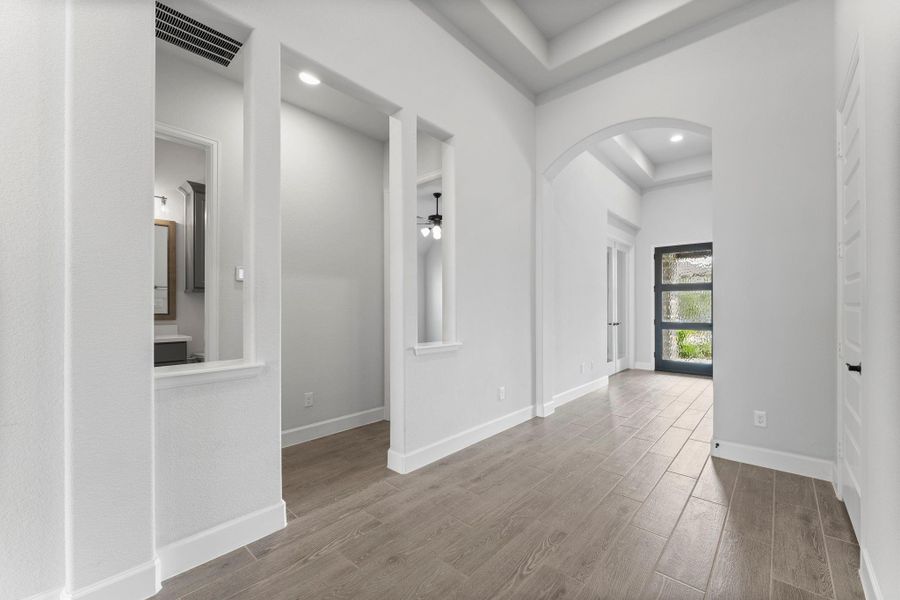 Two secondary bedrooms and a full bathroom are tucked away behind a private hallway. From smart switches to central vac, it’s as convenient as it is beautiful. Two secondary bedrooms and a full bathroom are tucked away behind a private hallway. From smart switches to central vac, it’s as convenient as it is beautiful.